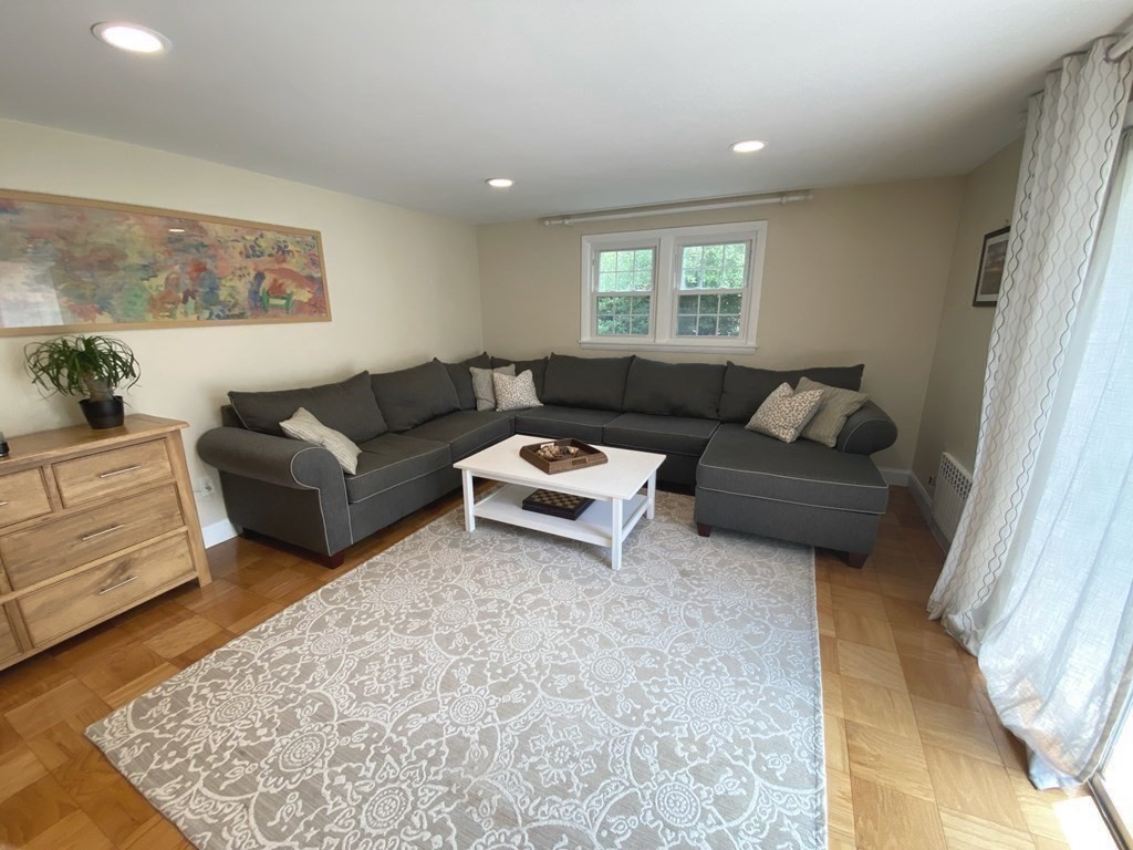 13 Pine Knoll Road Lexington, MA 02420 - Photo 9 of 24 a living room with furniture and a rug