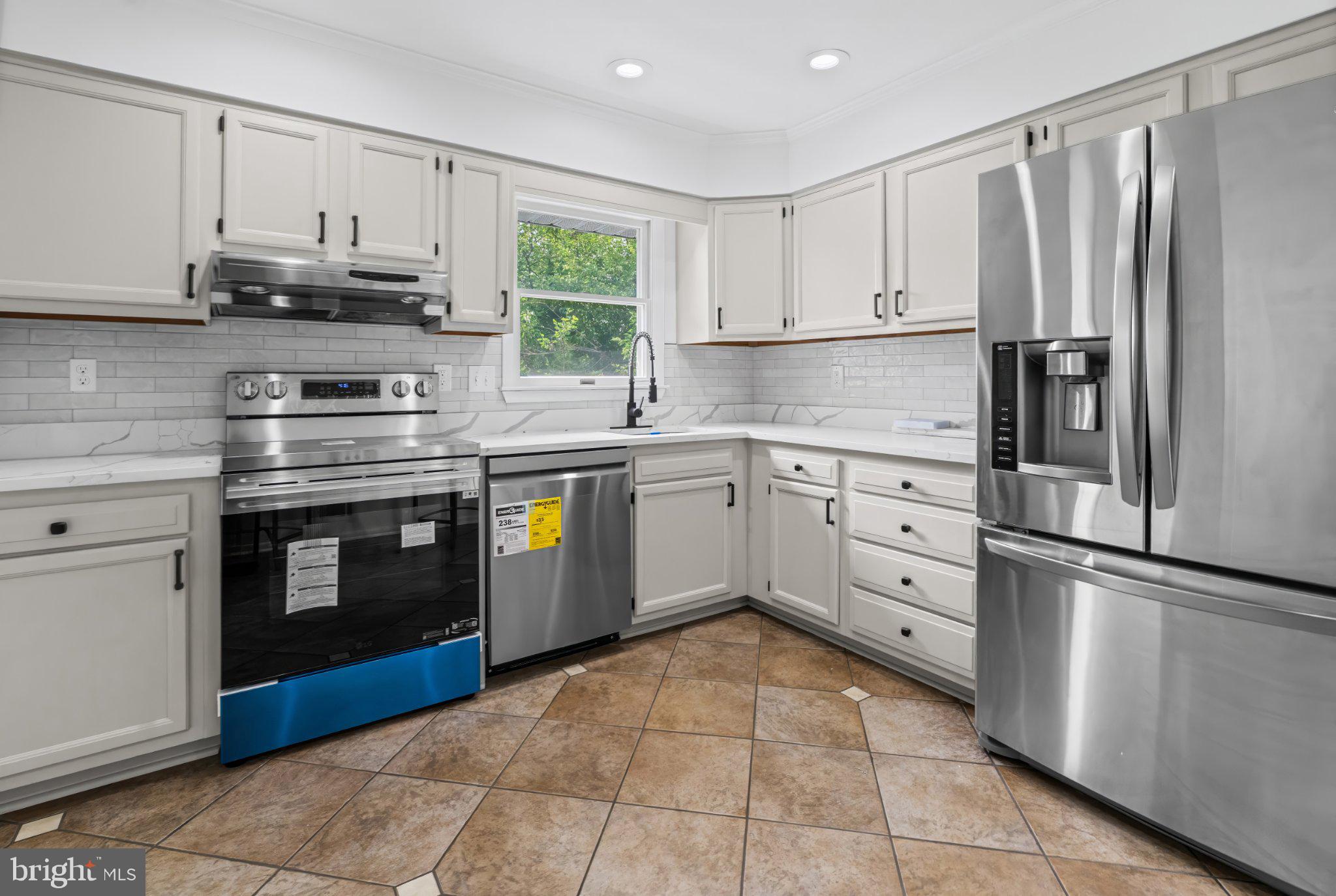 1317 Roxboro Road Baltimore, MD 21237 - Photo 7 of 30 Modern kitchen with sleek finishes.