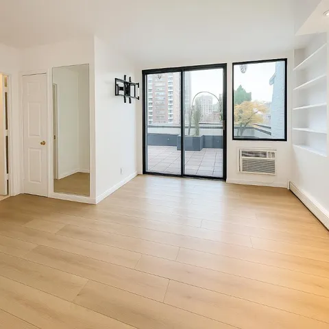 a view of an empty room with a window