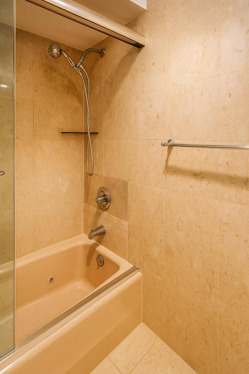 507 East 80th Street, Unit PH8R Manhattan, NY 10075 - Photo 8 of 22 a bathroom with a shower and a bath tub