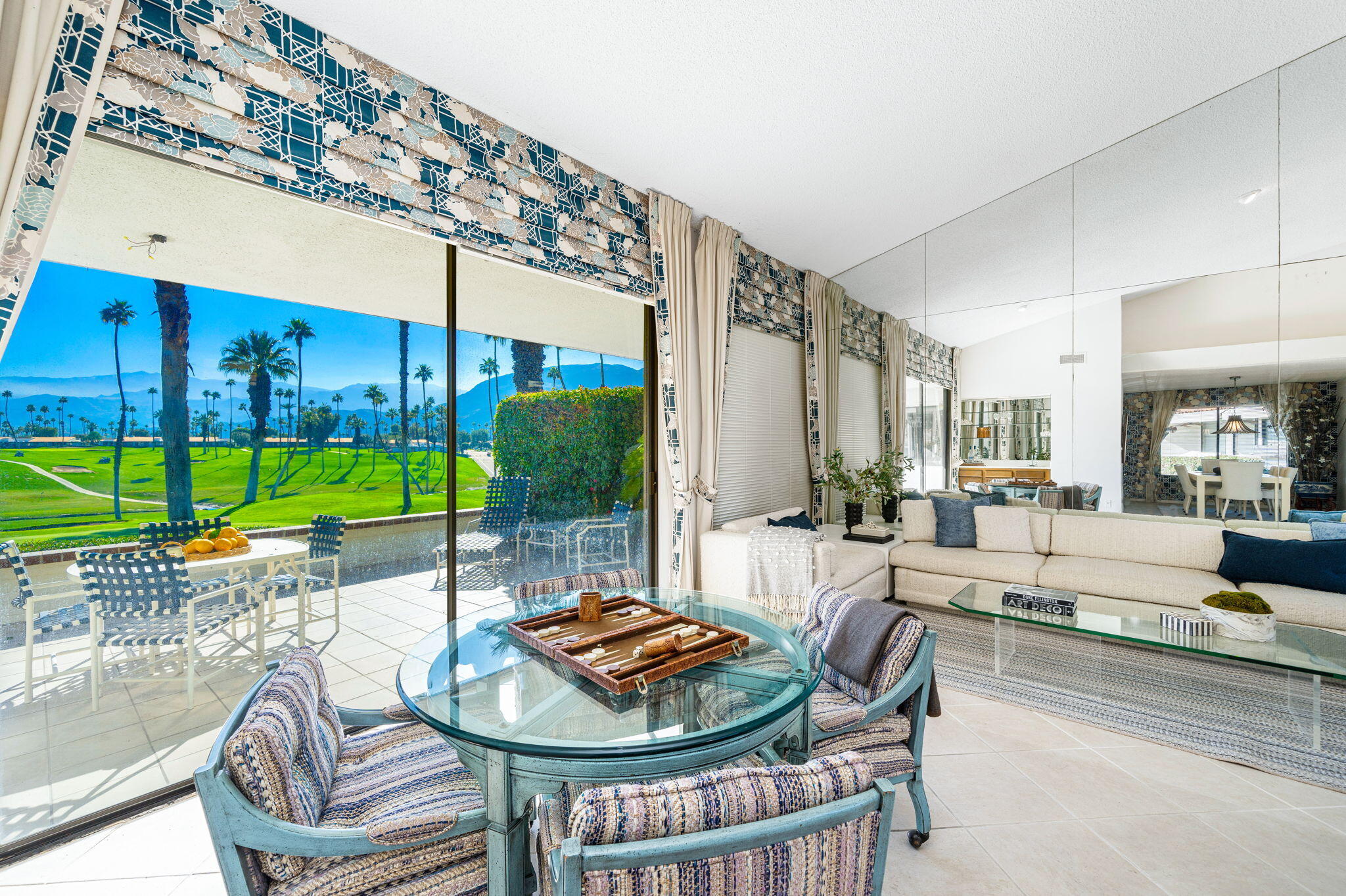 7 Leon Way Rancho Mirage, CA 92270 - Photo 11 of 45 a living room with furniture and a floor to ceiling window
