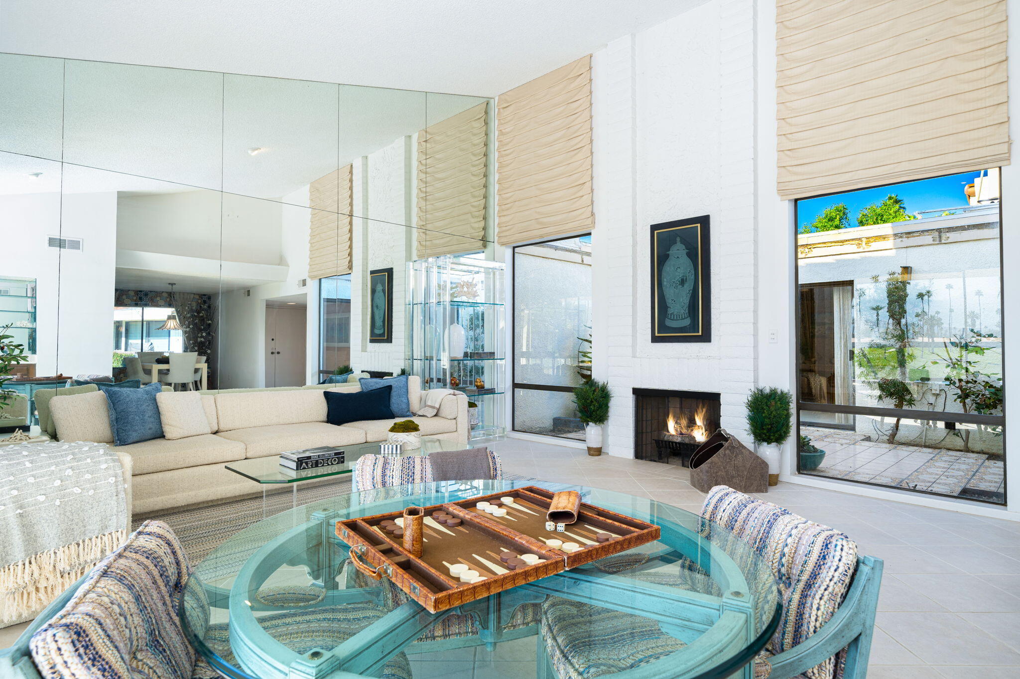 7 Leon Way Rancho Mirage, CA 92270 - Photo 12 of 45 a living room with furniture fireplace and a table