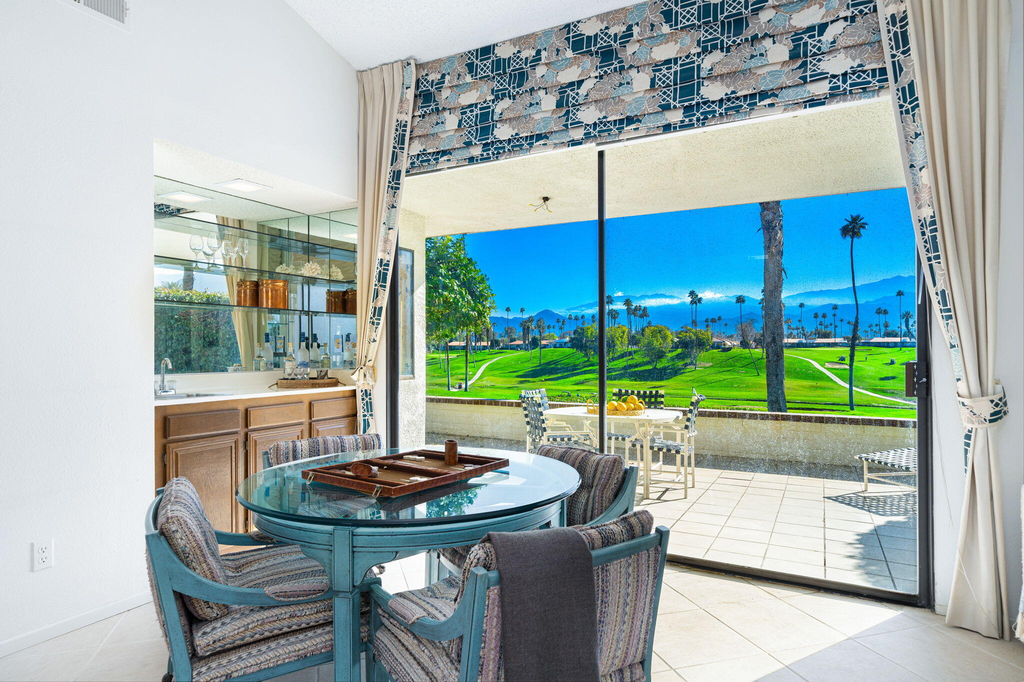 7 Leon Way Rancho Mirage, CA 92270 - Photo 13 of 45 a view of a table and chairs in patio