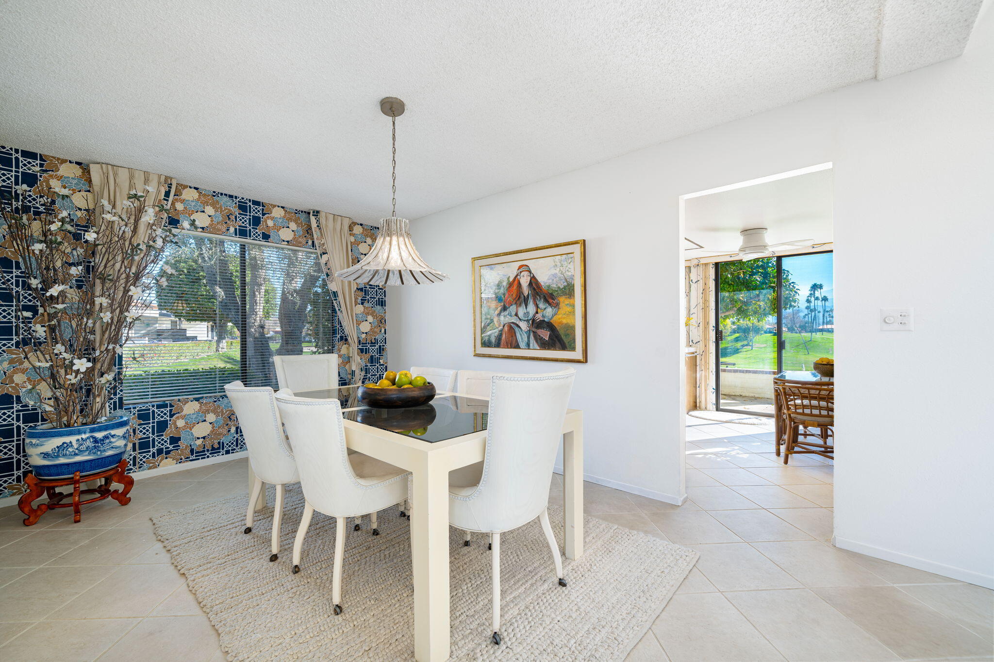 7 Leon Way Rancho Mirage, CA 92270 - Photo 14 of 45 a dining room with furniture mountain view and a garden