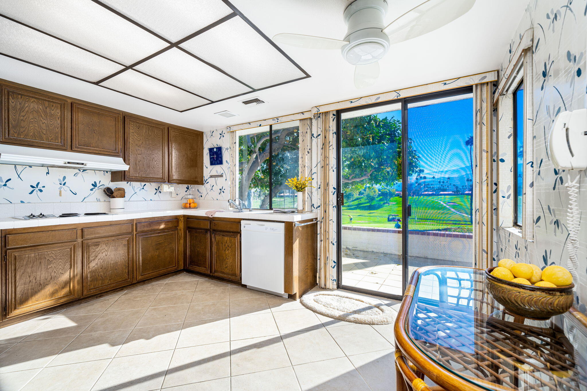 7 Leon Way Rancho Mirage, CA 92270 - Photo 15 of 45 a kitchen with a sink a counter top space and stainless steel appliances