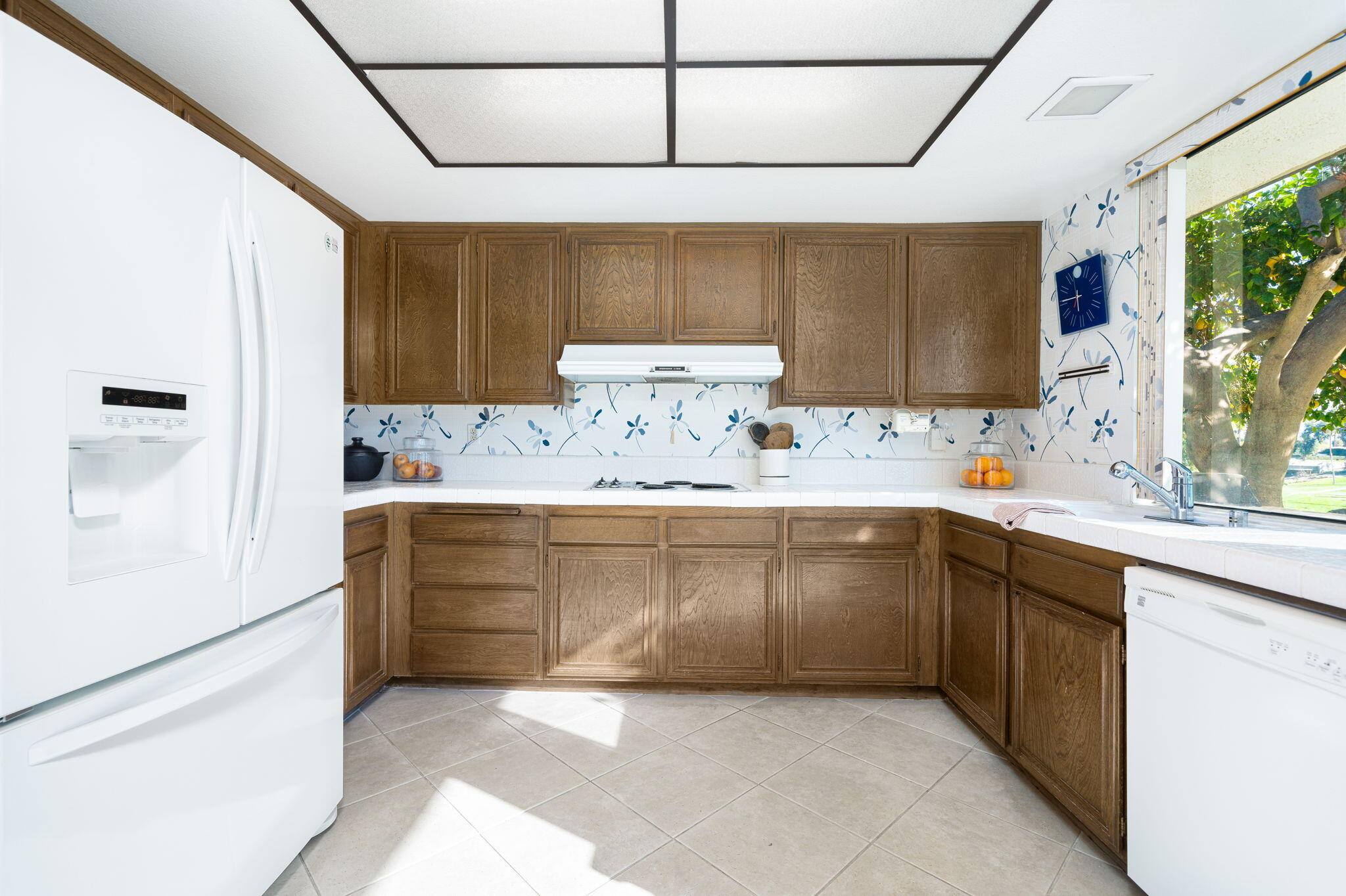 7 Leon Way Rancho Mirage, CA 92270 - Photo 16 of 45 a kitchen with a cabinets and window