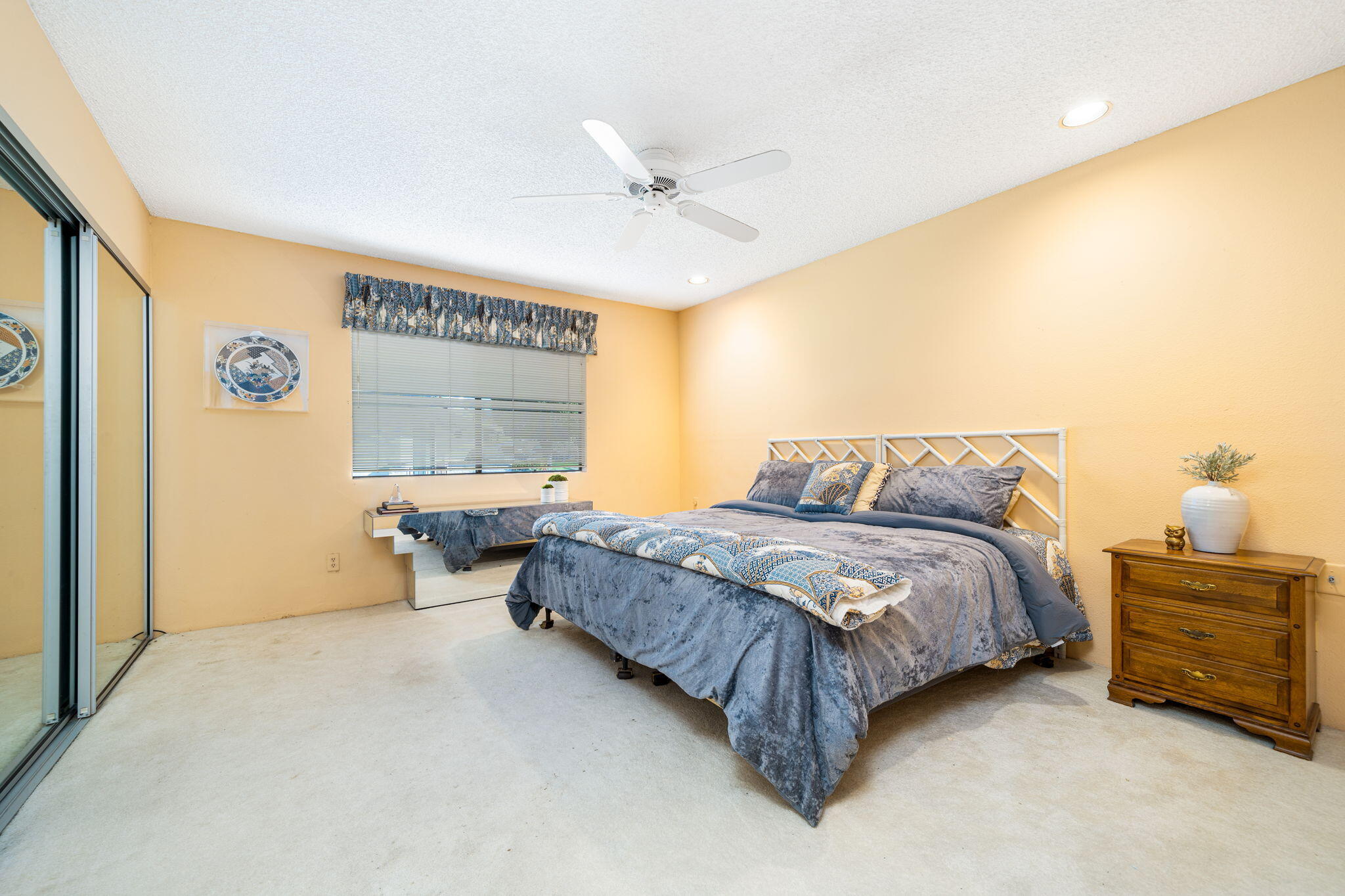 7 Leon Way Rancho Mirage, CA 92270 - Photo 18 of 45 a spacious bedroom with a bed and a window
