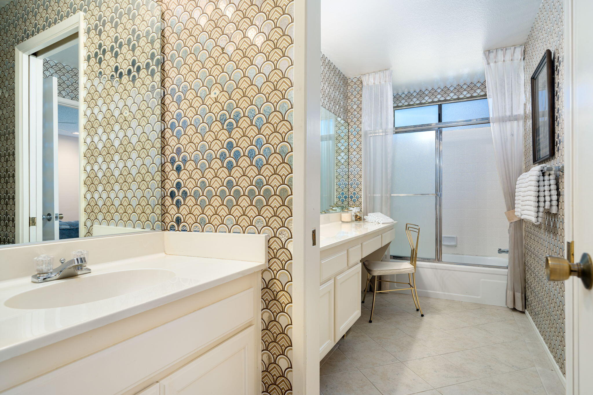 7 Leon Way Rancho Mirage, CA 92270 - Photo 20 of 45 a bathroom with a tub sink and mirror
