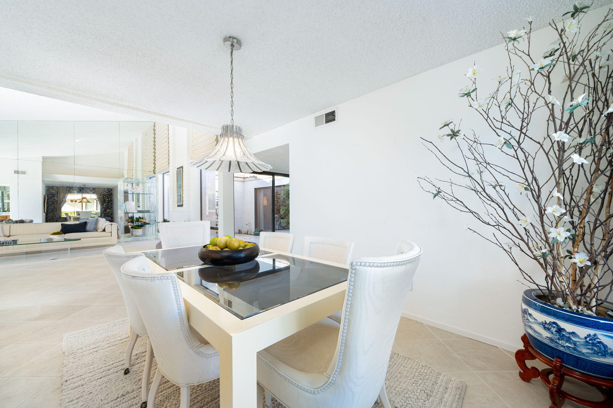 7 Leon Way Rancho Mirage, CA 92270 - Photo 27 of 45 a kitchen with a table and chairs