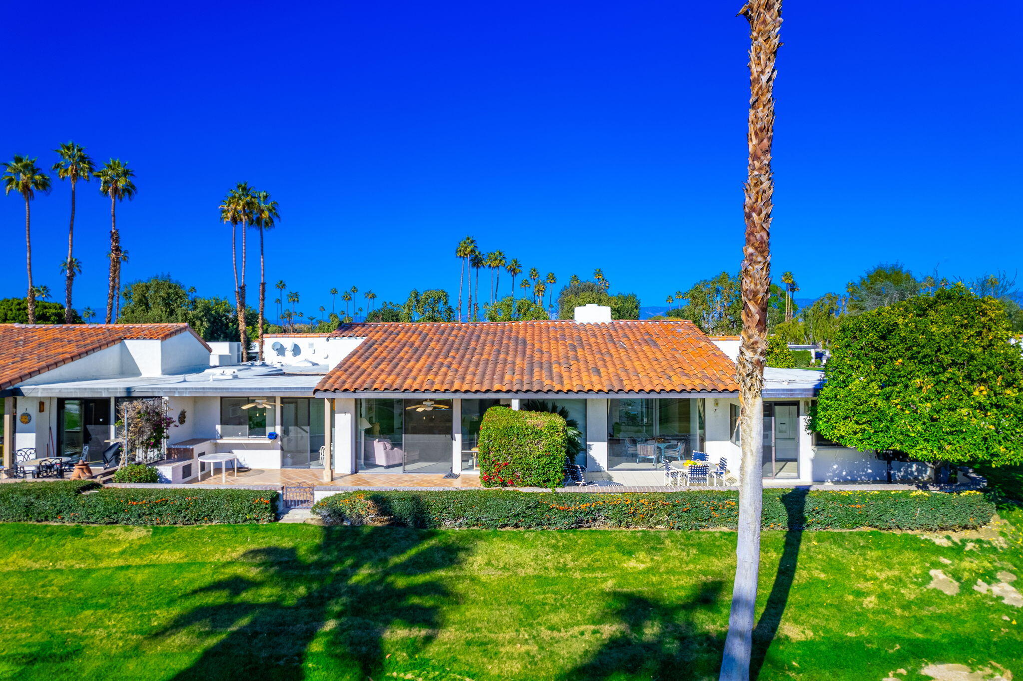 7 Leon Way Rancho Mirage, CA 92270 - Photo 32 of 45 front view of a house with a yard