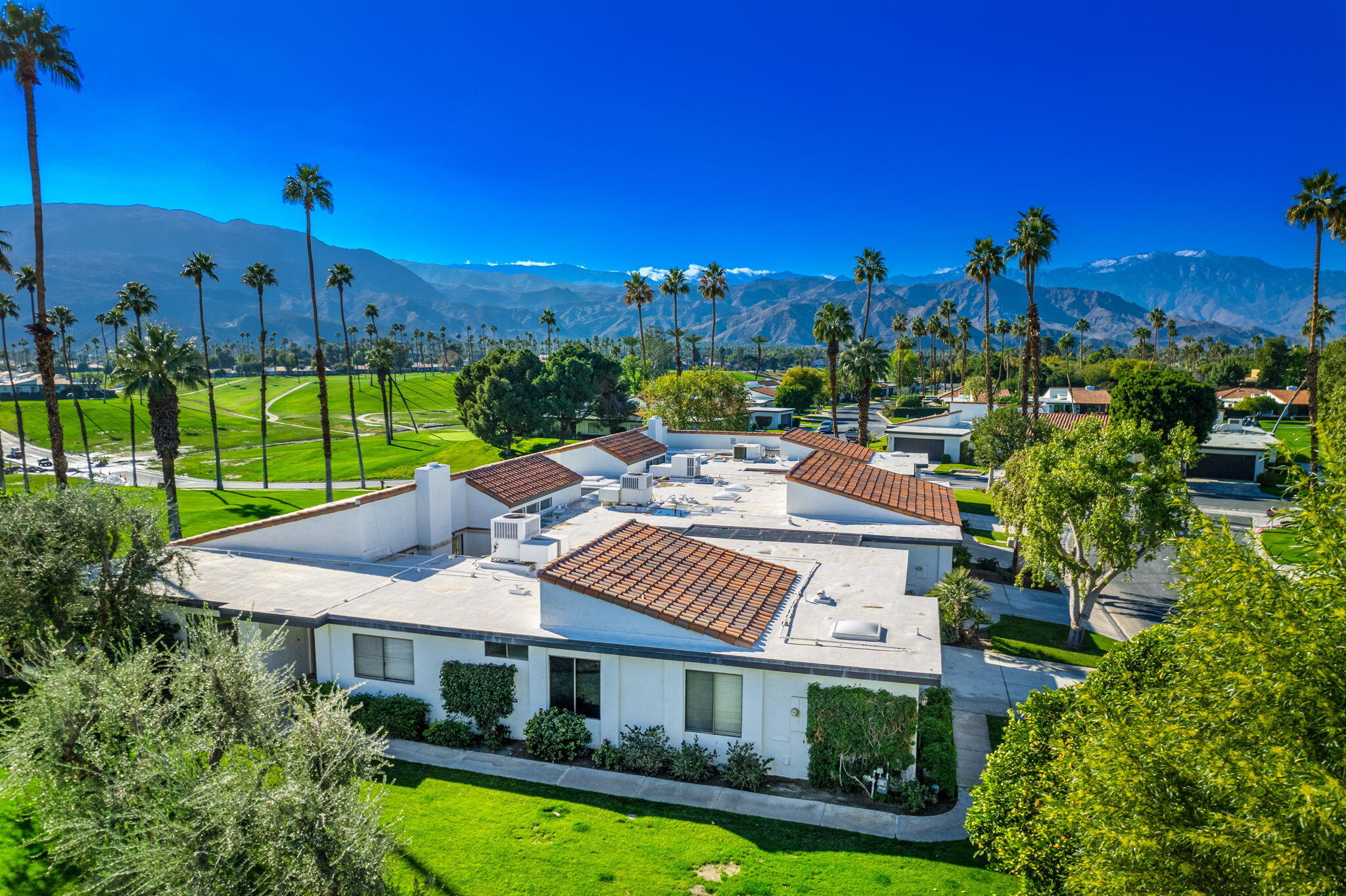7 Leon Way Rancho Mirage, CA 92270 - Photo 36 of 45 a view of a patio with swimming pool and outdoor seating