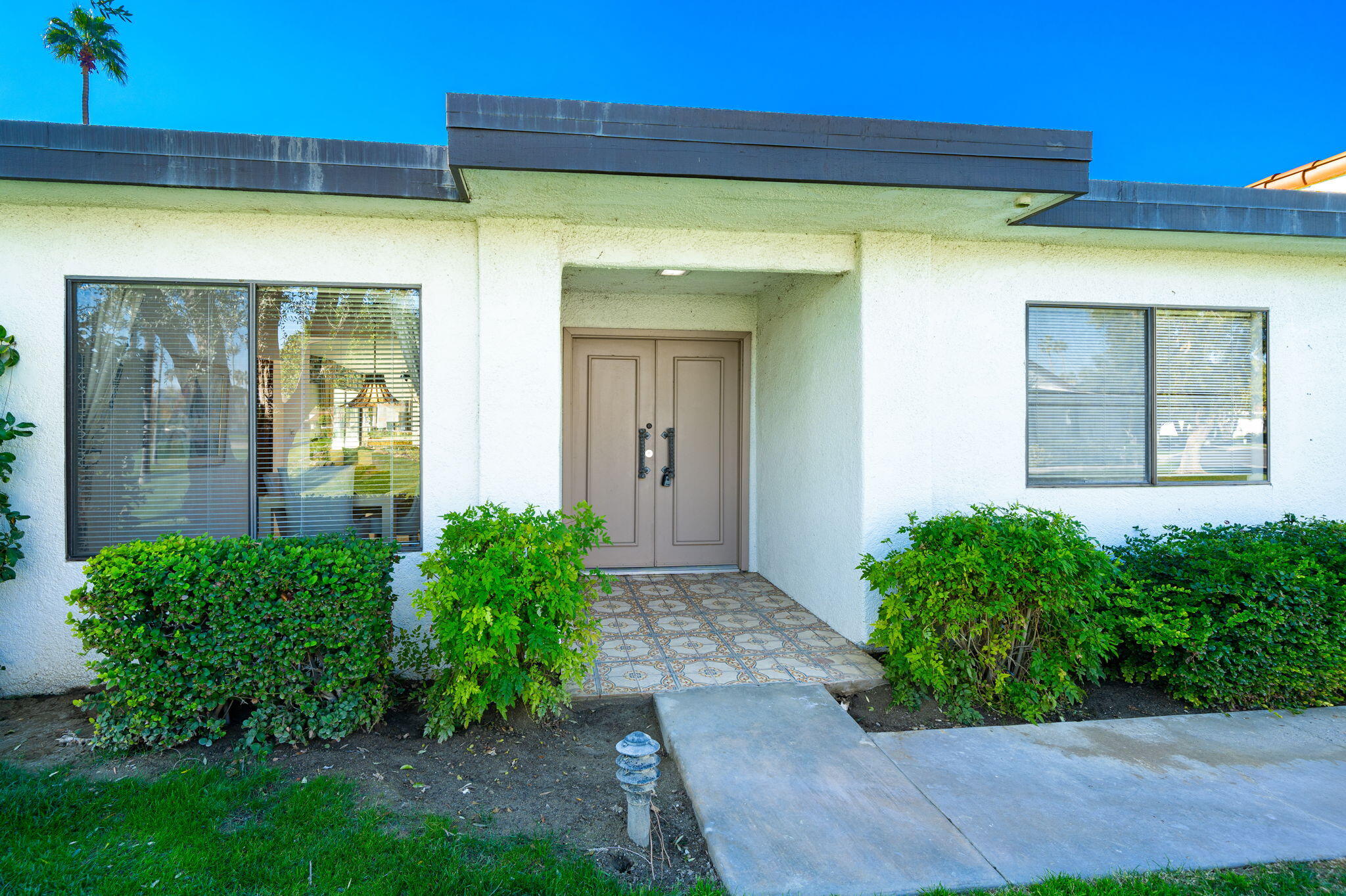7 Leon Way Rancho Mirage, CA 92270 - Photo 43 of 45 a view of a pathway with a house in the background