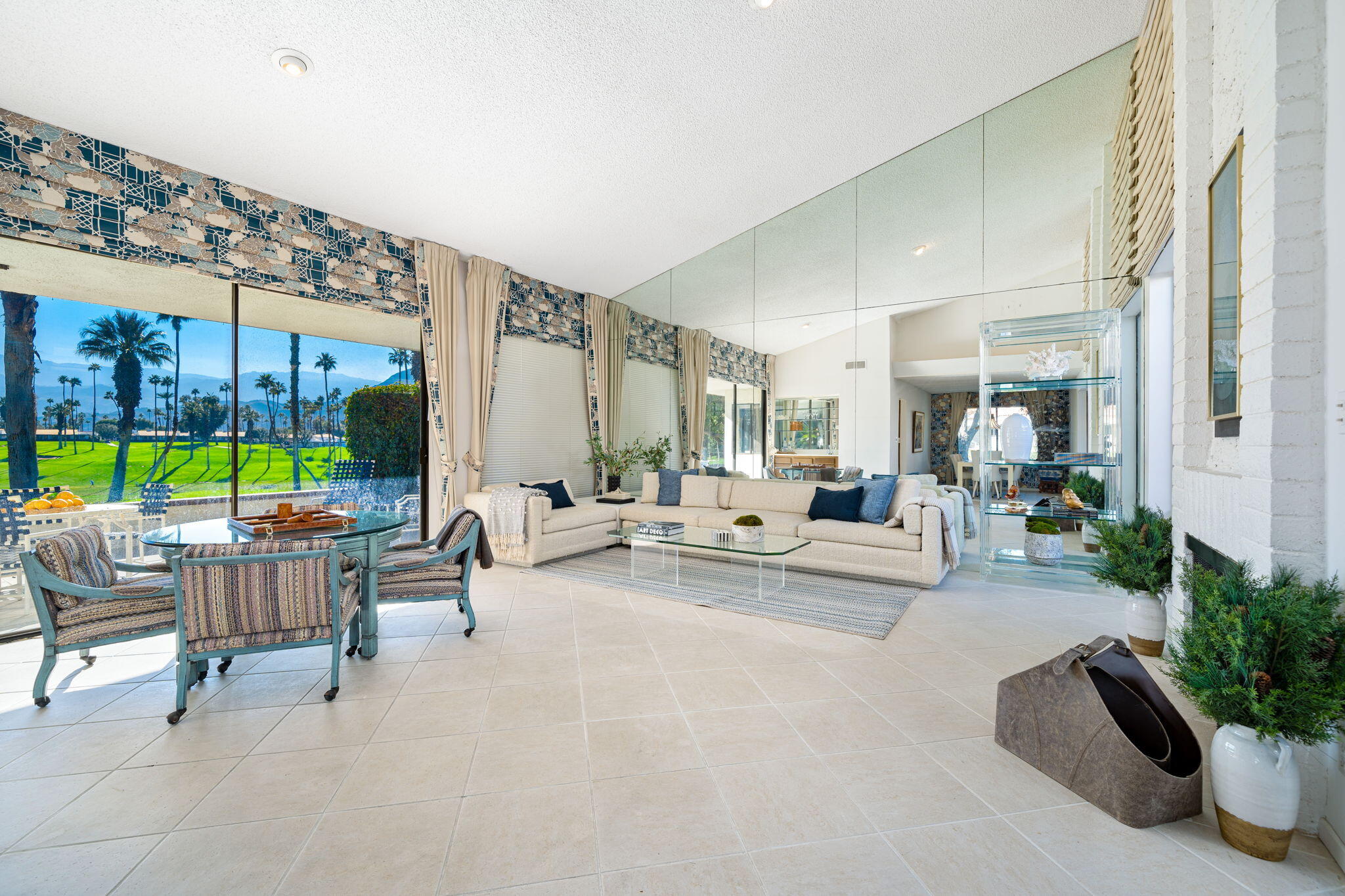 7 Leon Way Rancho Mirage, CA 92270 - Photo 8 of 45 a living room with patio furniture and a large window