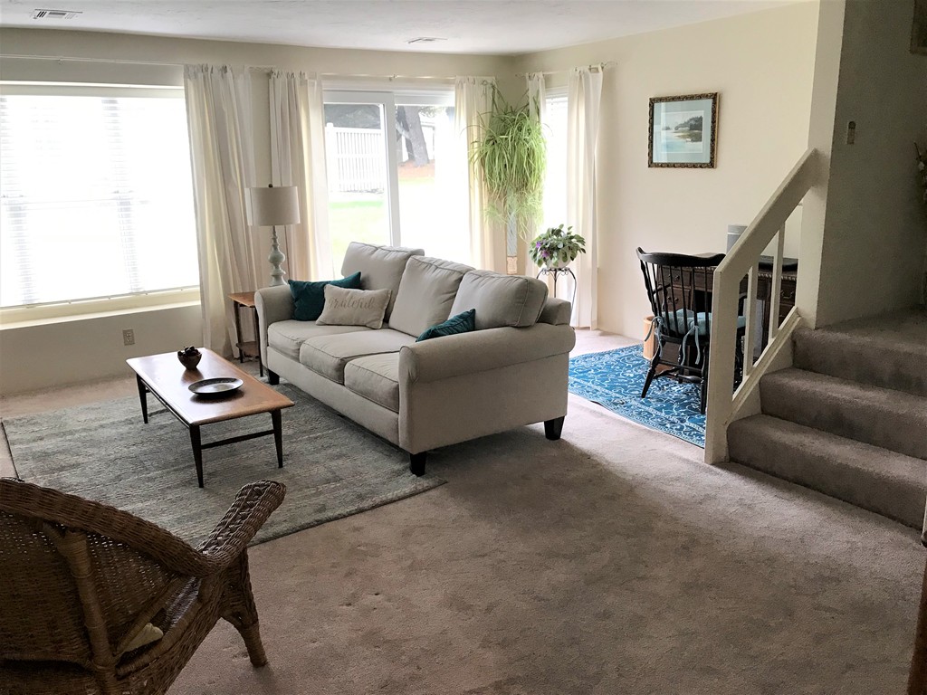 301 Ridgefield Circle, Unit B Clinton, MA 01510 - Photo 5 of 21 a living room with furniture a window and a potted plant