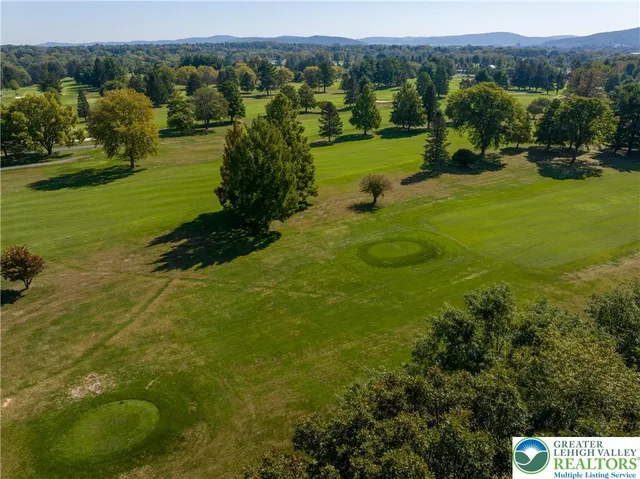 a view of a lake with a building in background