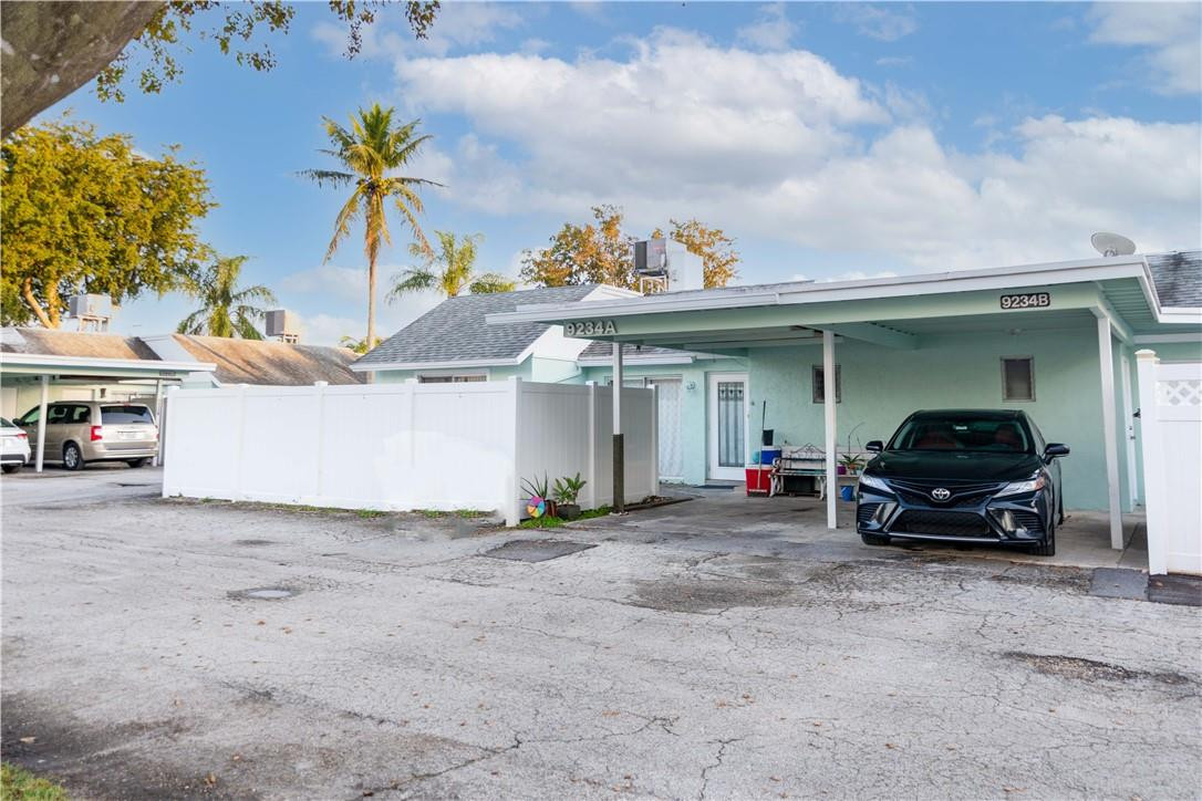 9234 Southwest 5th Street, Unit A Boca Raton, FL 33428 - Photo 1 of 20 a view of car in front of house