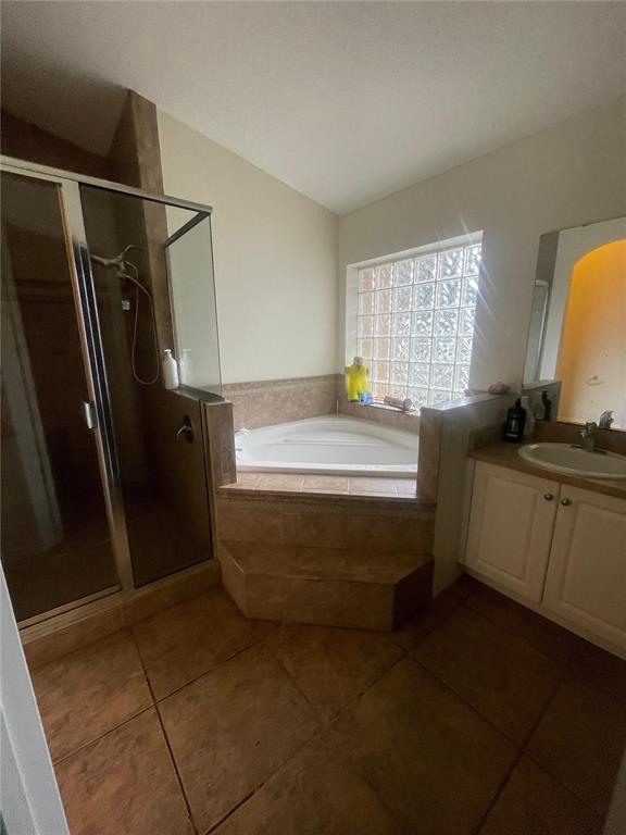 396 Kettering Road Deltona, FL 32725 - Photo 16 of 25 a bathroom with a sink and a mirror