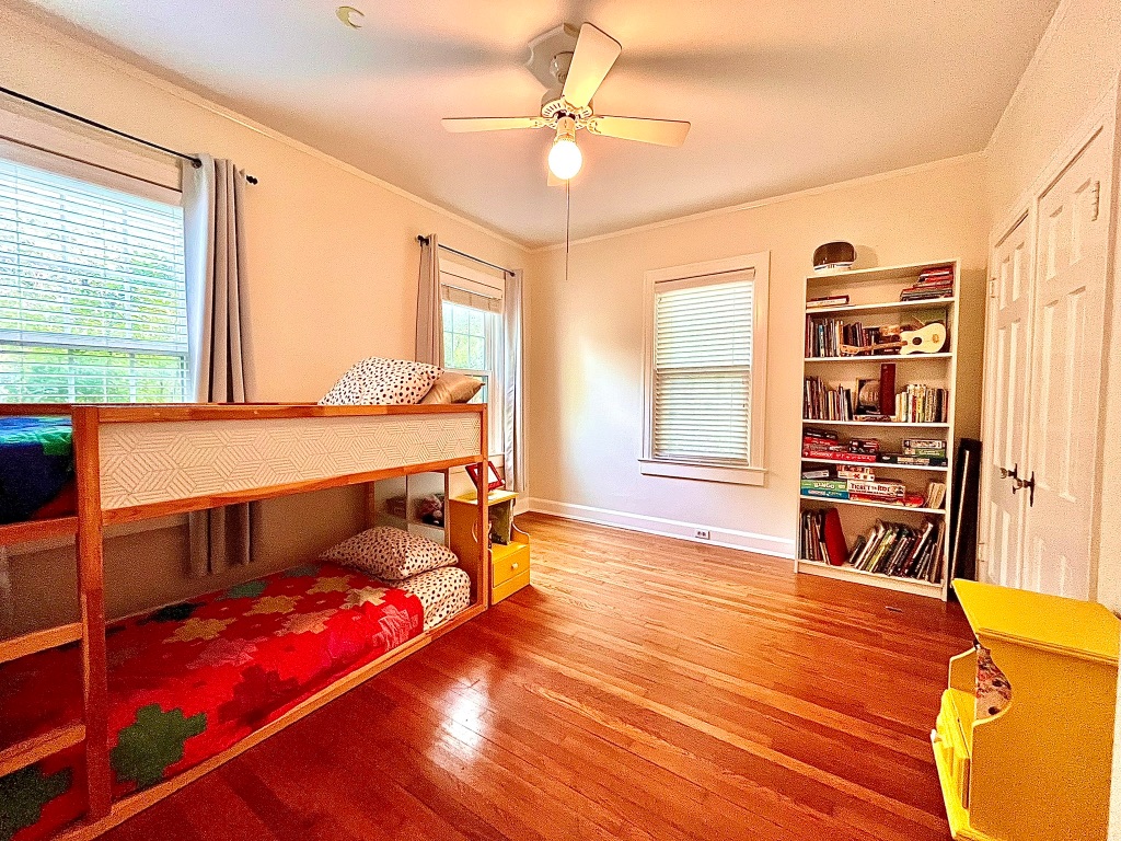 4501 Sinclair Avenue Austin, TX 78756 - Photo 13 of 21 a bedroom with furniture and a large window