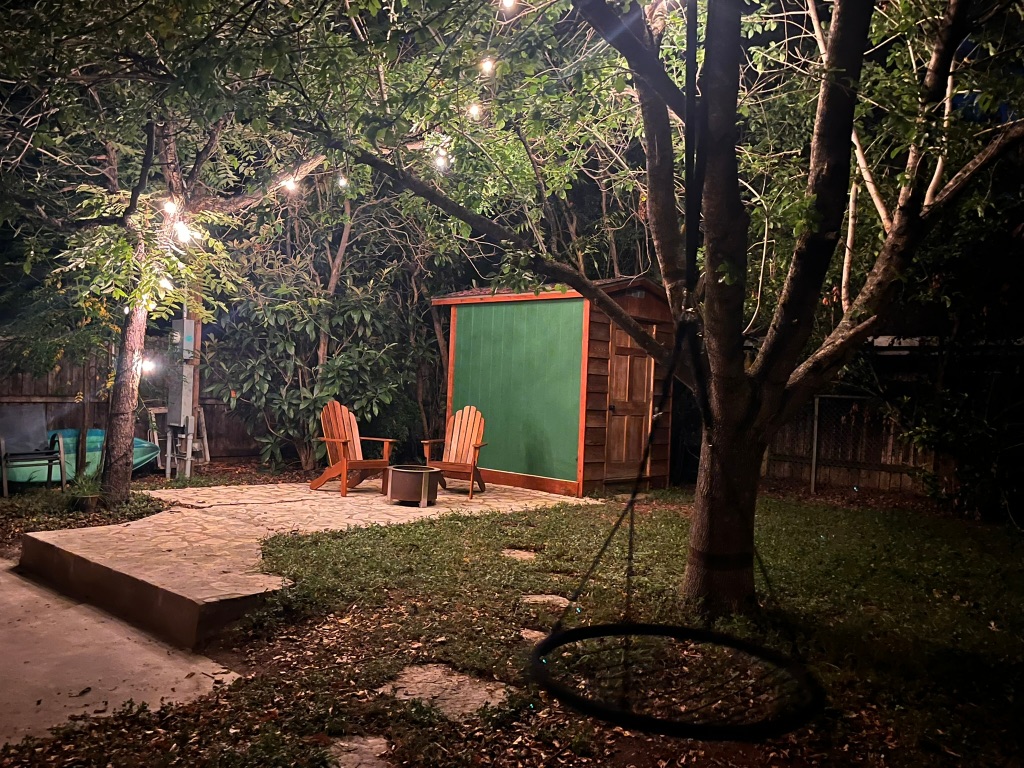 4501 Sinclair Avenue Austin, TX 78756 - Photo 20 of 21 a view of a backyard with table and chairs and a fire pit
