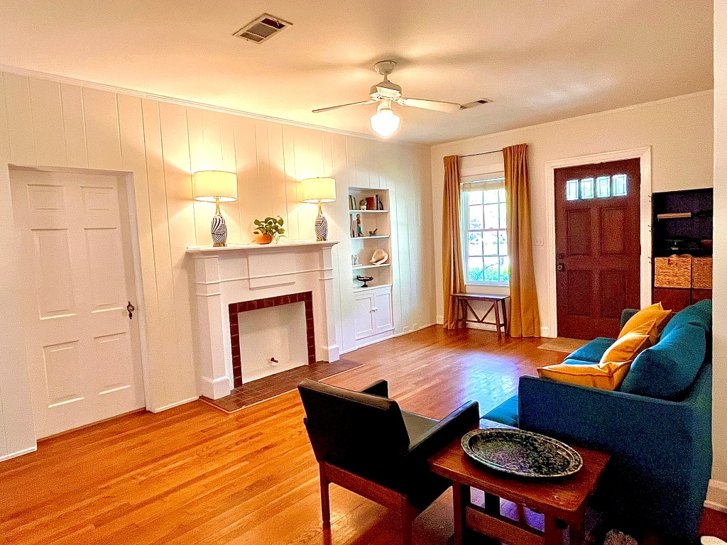 4501 Sinclair Avenue Austin, TX 78756 - Photo 6 of 21 a living room with furniture and a fireplace