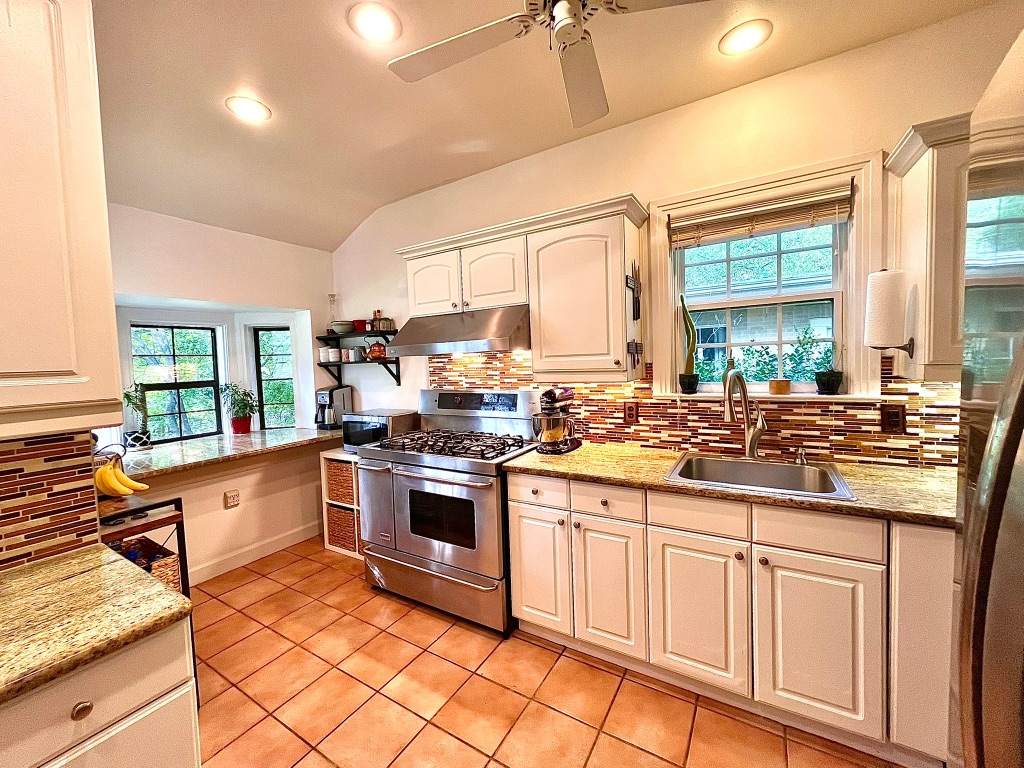 4501 Sinclair Avenue Austin, TX 78756 - Photo 9 of 21 a kitchen with stainless steel appliances a stove sink and cabinets