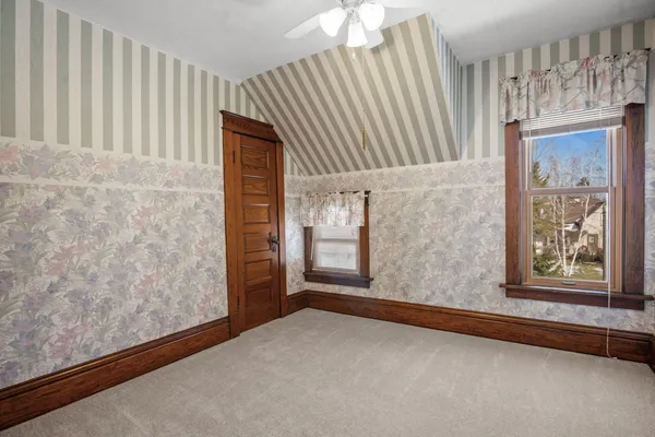 wooden floor in an empty room and a window