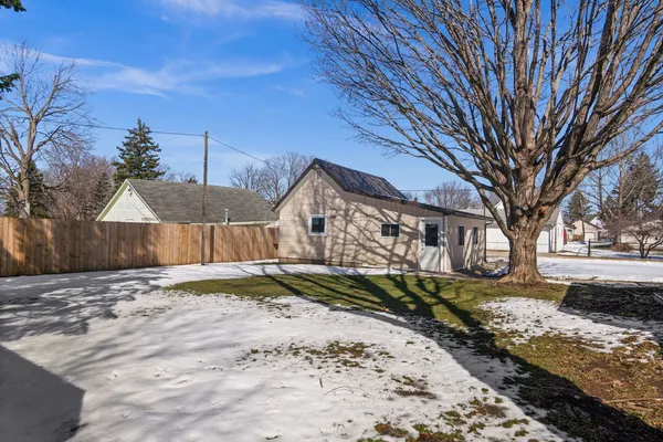 a view of a house with a snow in front of it