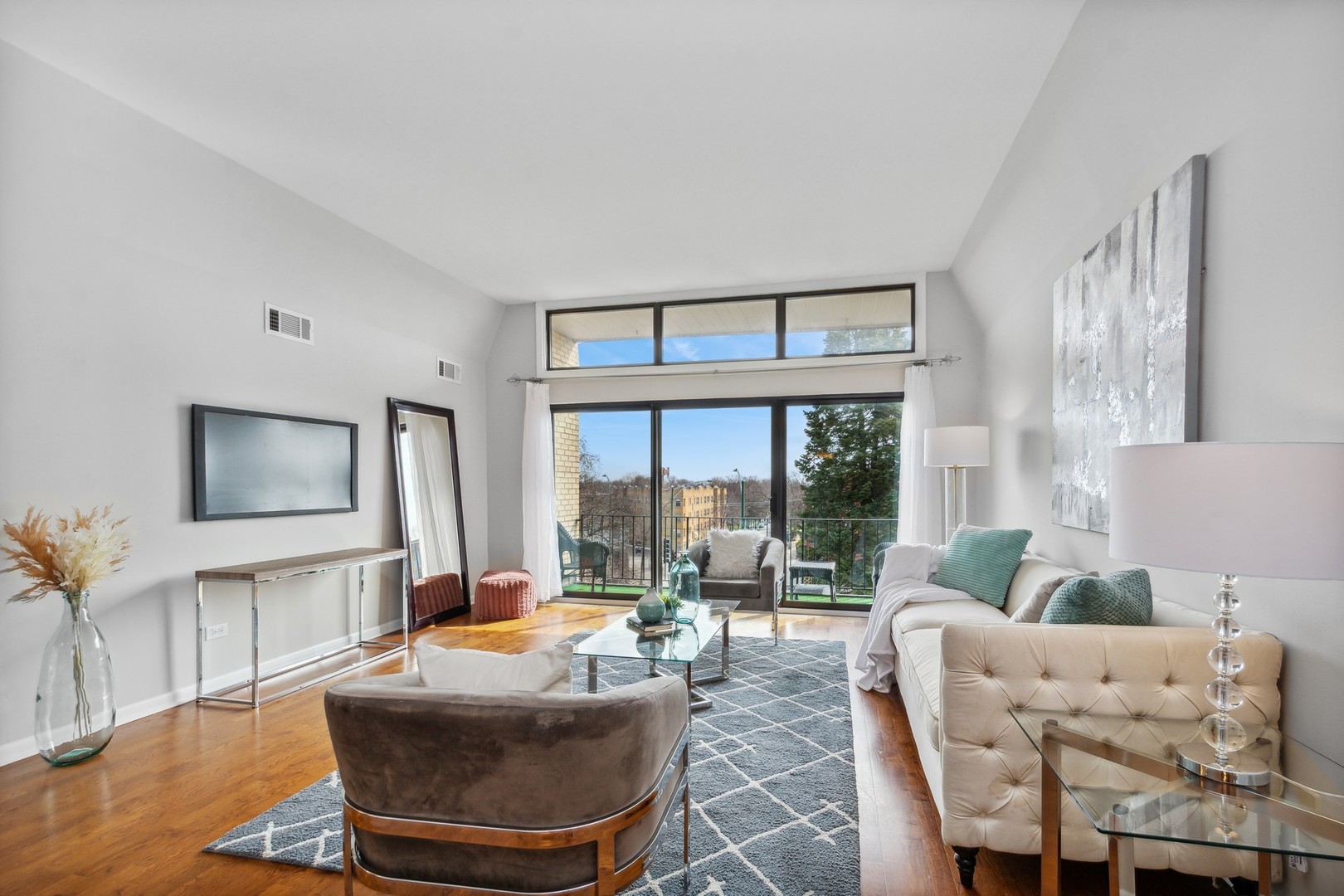 7200 North Ridge Boulevard, Unit 4E Chicago, IL 60645 - Photo 4 of 21 a living room with furniture and a large window