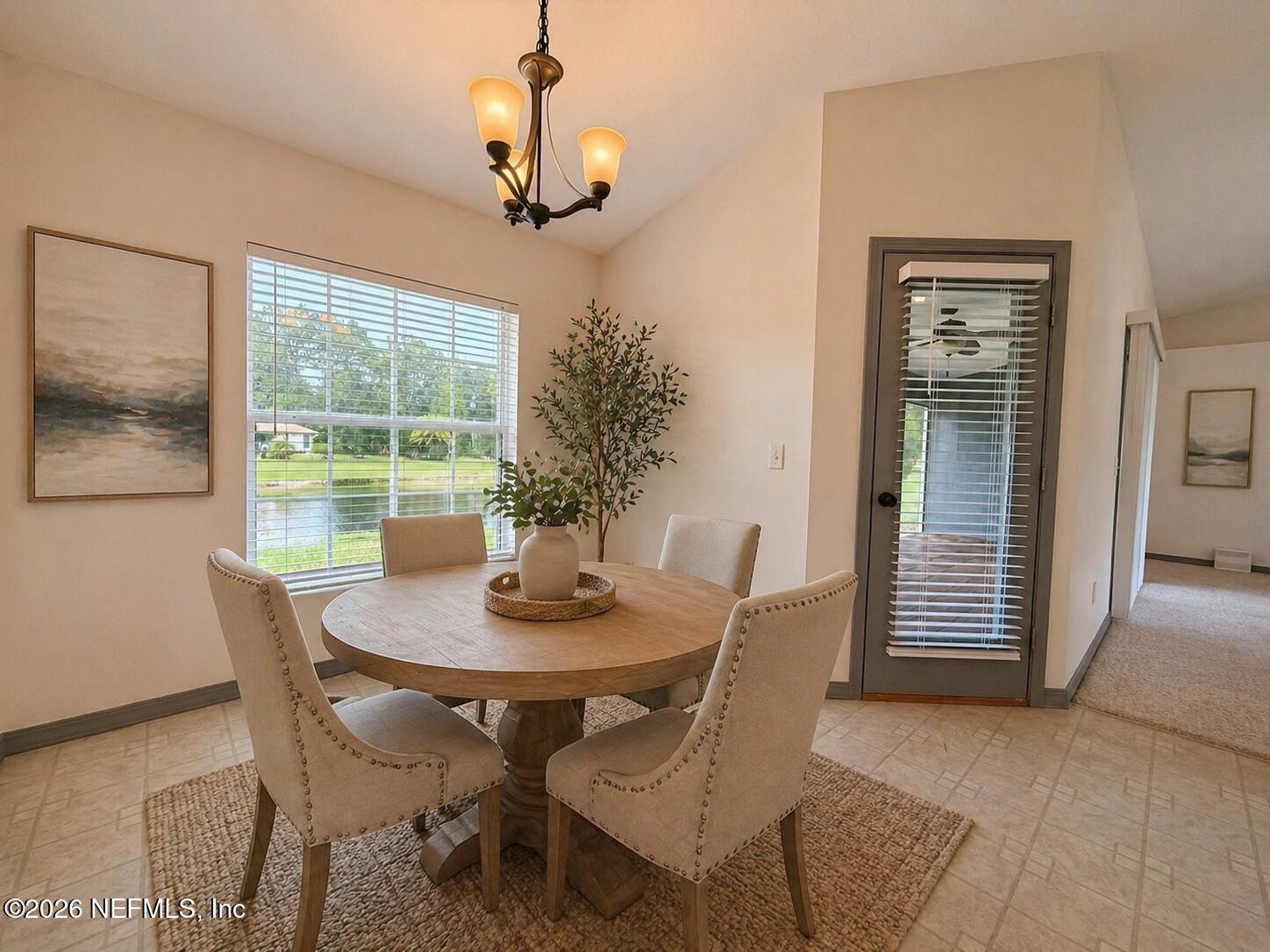 4728 Innisbrook Court North Elkton, FL 32033 - Photo 12 of 28 a view of a dining room with furniture window and outside view