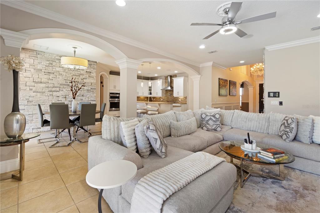 1445 Via Sangro Place Winter Park, FL 32792 - Photo 11 of 58 a living room with furniture kitchen view and a large window