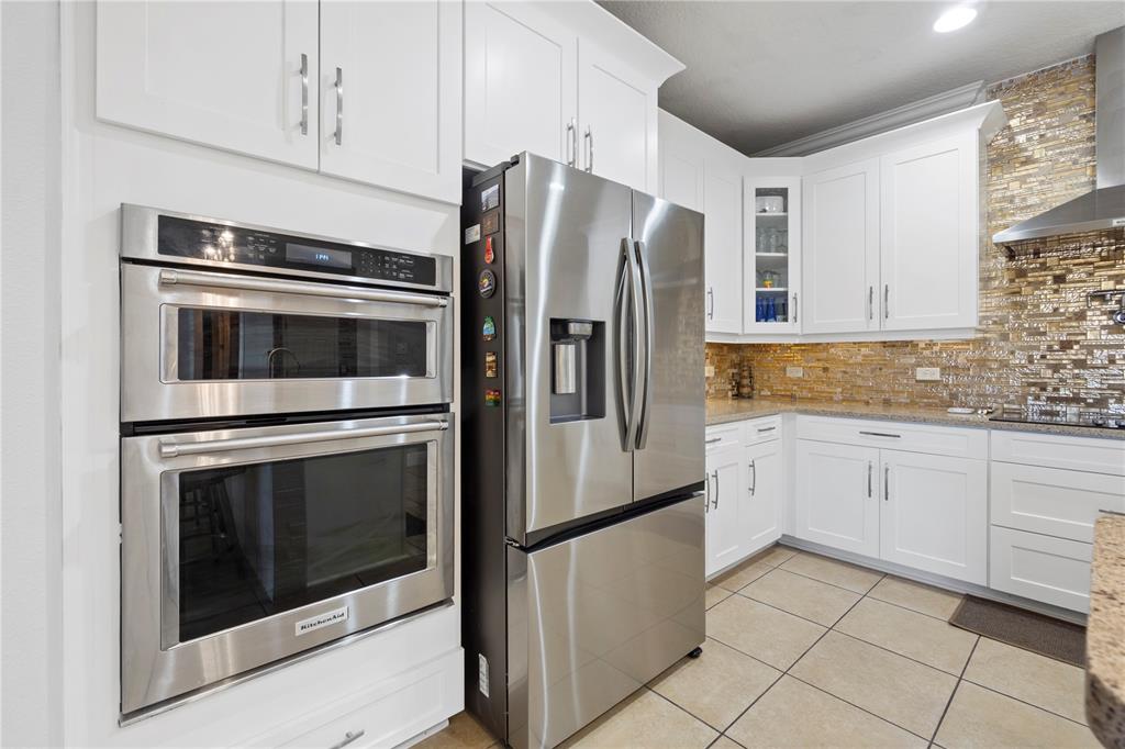 1445 Via Sangro Place Winter Park, FL 32792 - Photo 18 of 58 a kitchen with stainless steel appliances granite countertop a refrigerator stove and sink
