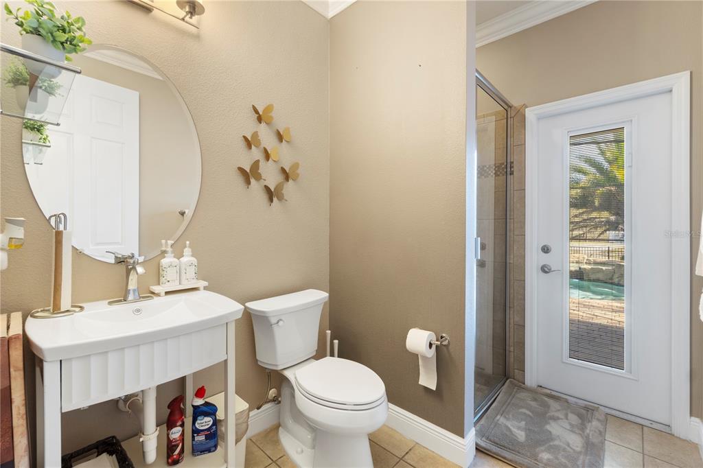 1445 Via Sangro Place Winter Park, FL 32792 - Photo 21 of 58 a bathroom with a toilet a sink and a mirror