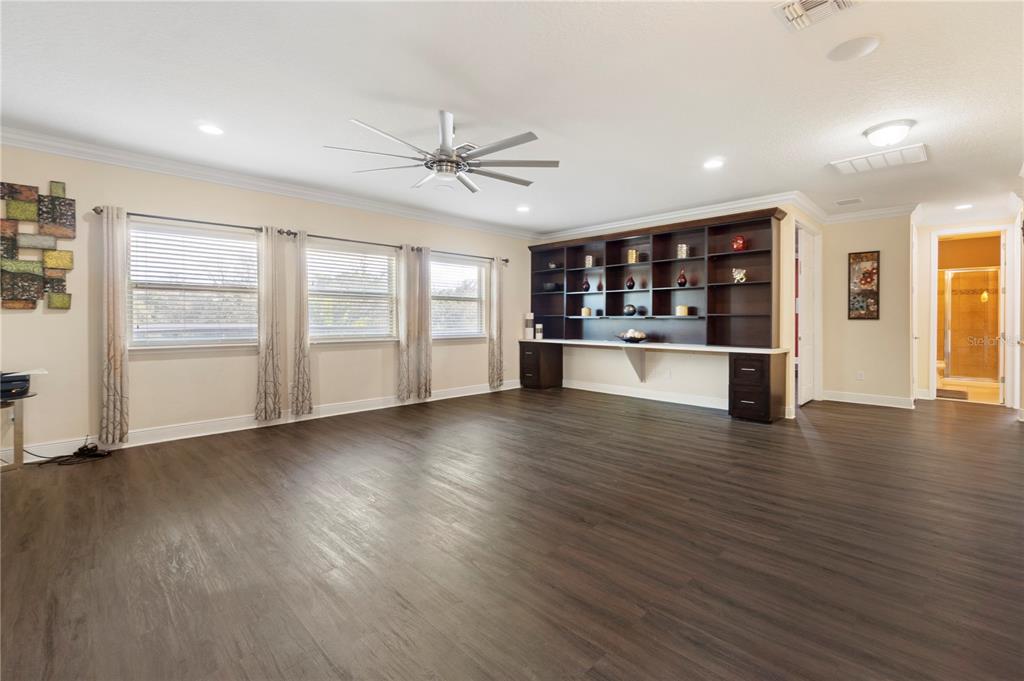 1445 Via Sangro Place Winter Park, FL 32792 - Photo 28 of 58 a view of empty room with wooden floor and fan
