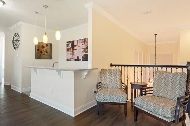a kitchen with a sink and a wooden cabinets