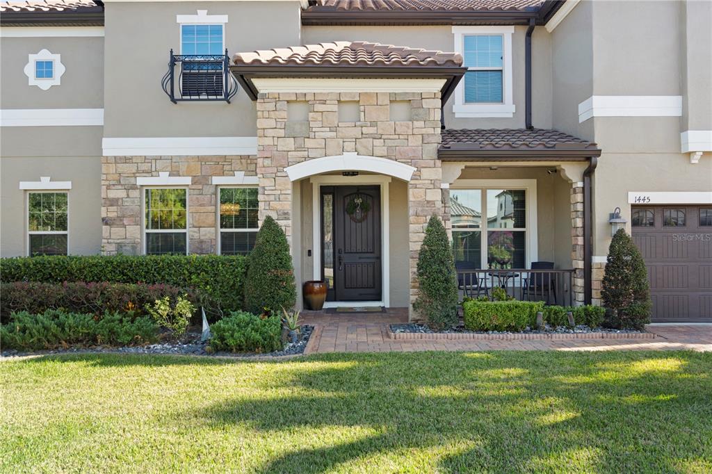 1445 Via Sangro Place Winter Park, FL 32792 - Photo 3 of 58 a front view of a house with a yard
