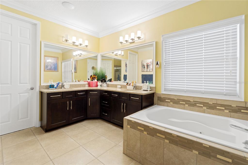 1445 Via Sangro Place Winter Park, FL 32792 - Photo 33 of 58 a kitchen with a sink and a wooden cabinets