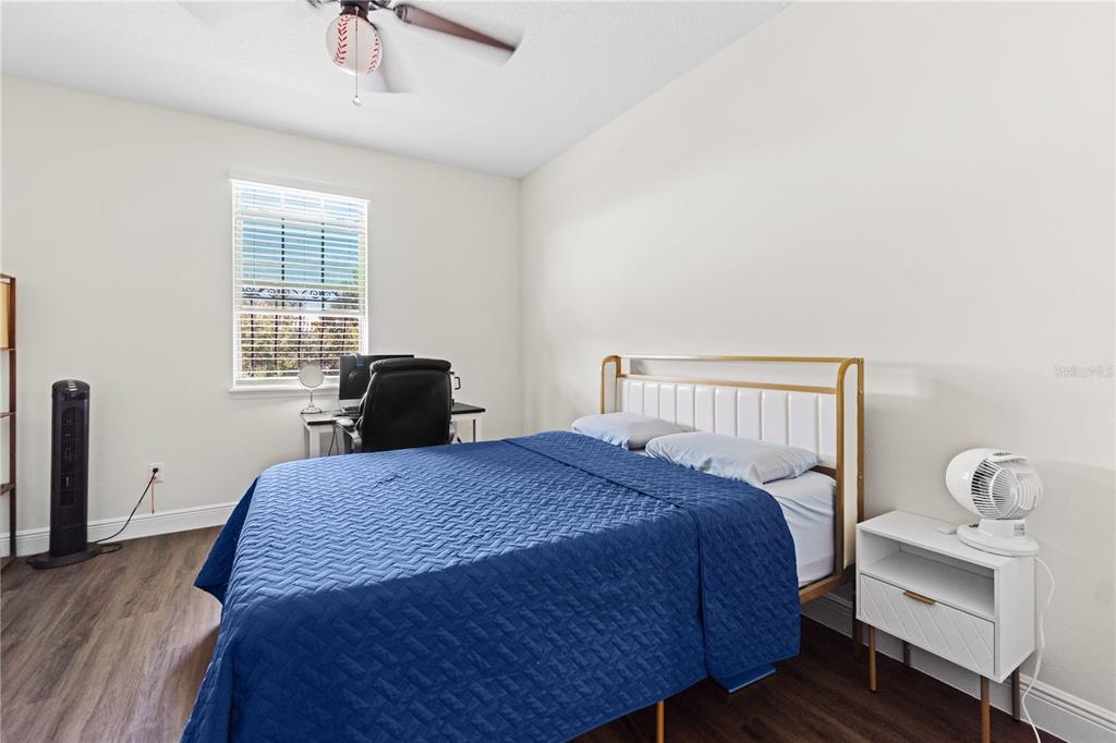 1445 Via Sangro Place Winter Park, FL 32792 - Photo 36 of 58 a bedroom with a bed and a window