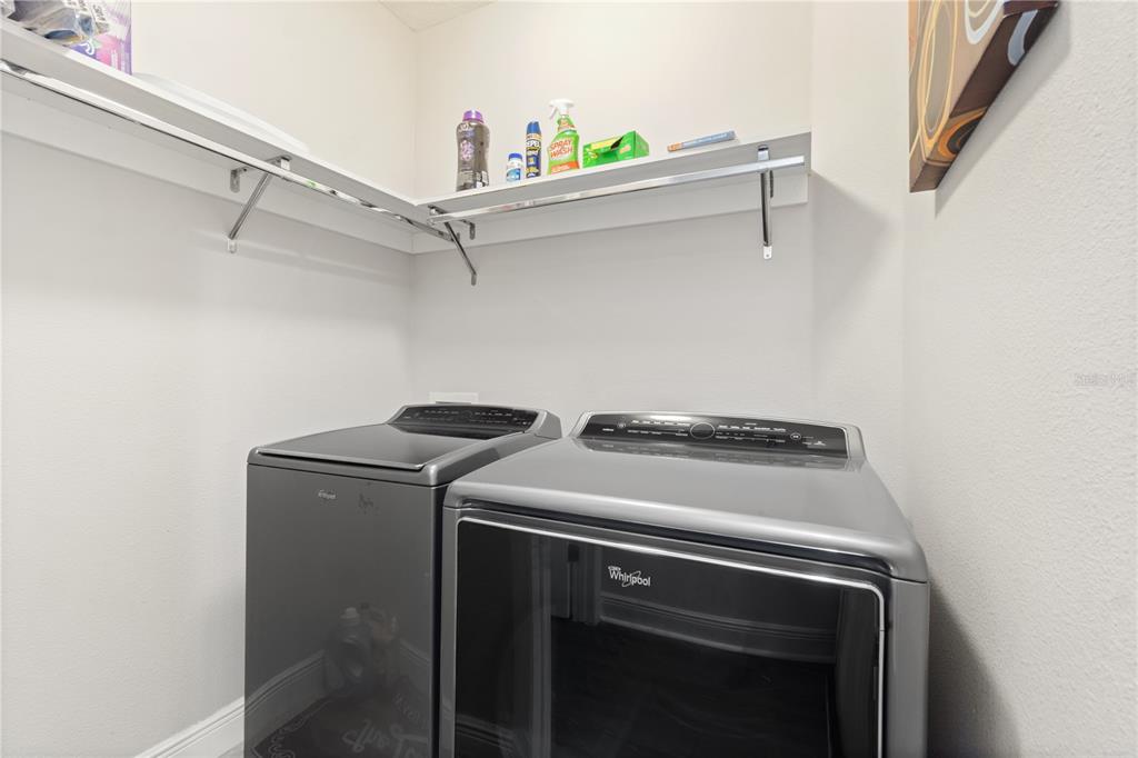 1445 Via Sangro Place Winter Park, FL 32792 - Photo 37 of 58 a utility room with dryer and washer