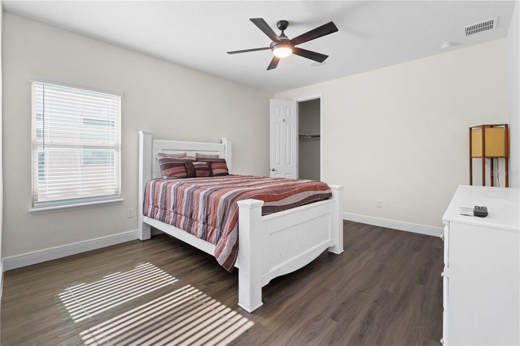 1445 Via Sangro Place Winter Park, FL 32792 - Photo 38 of 58 a bedroom with a bed and a window