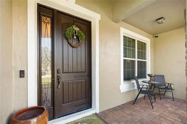 a view of a livingroom with furniture and front door