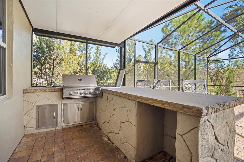 1445 Via Sangro Place Winter Park, FL 32792 - Photo 50 of 58 a kitchen with a sink and a stove