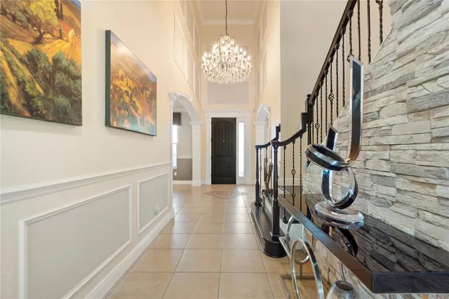 a view of a hallway with paintings on the walls