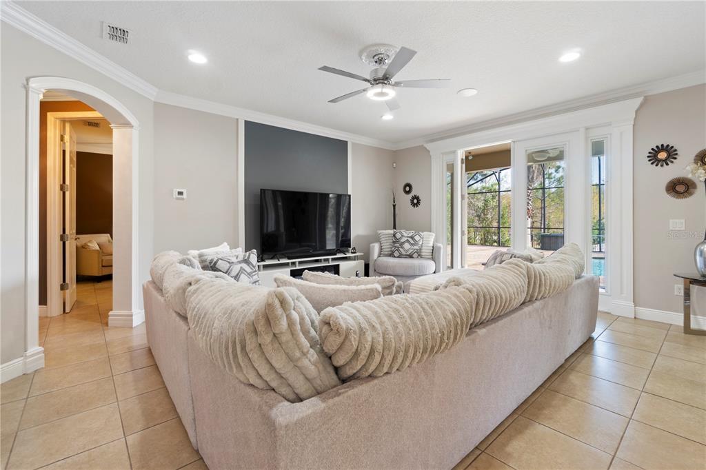 1445 Via Sangro Place Winter Park, FL 32792 - Photo 9 of 58 a living room with furniture and a flat screen tv