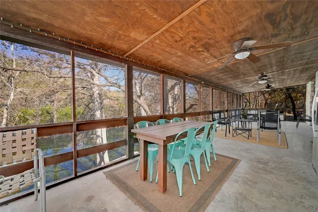 a dining room with furniture water view and mountain view