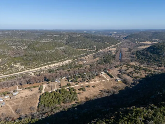 an aerial view of lot of residential houses with outdoor space