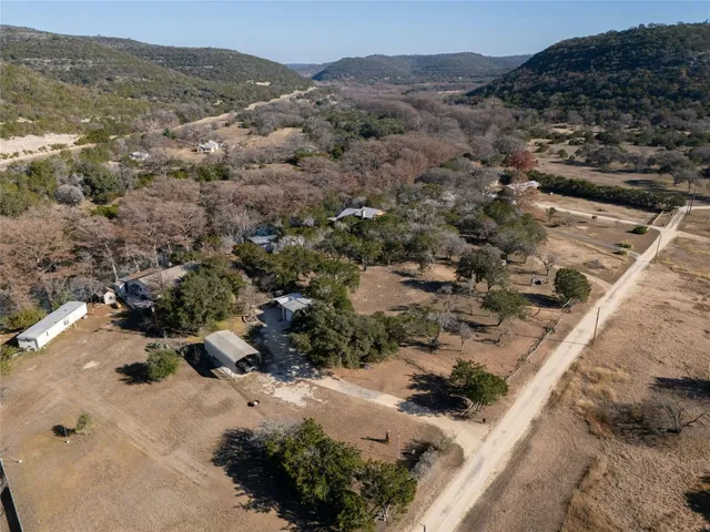 an aerial view of residential house and green space