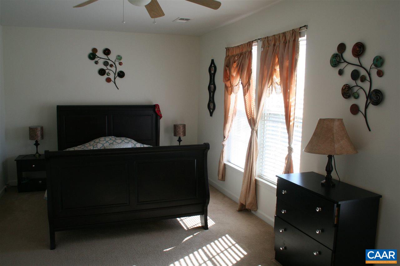 323 Rolkin Road Charlottesville, VA 22911 - Photo 23 of 47 a bedroom with a bed and a window