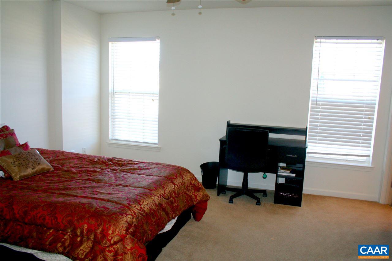 323 Rolkin Road Charlottesville, VA 22911 - Photo 26 of 47 a bedroom with a bed and a chair