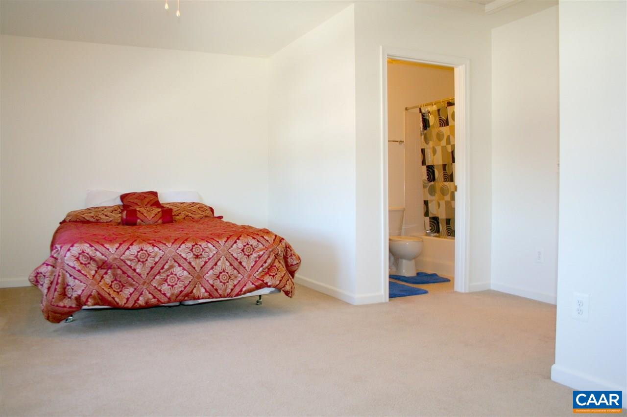 323 Rolkin Road Charlottesville, VA 22911 - Photo 32 of 47 a bedroom with a bed and a window
