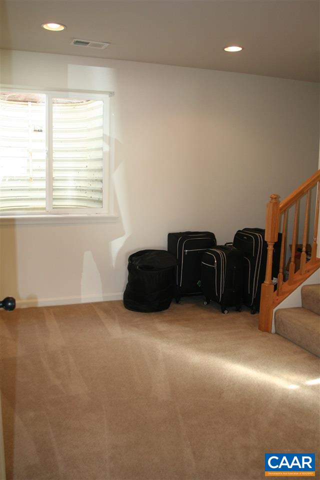 323 Rolkin Road Charlottesville, VA 22911 - Photo 38 of 47 a living room with furniture and a window